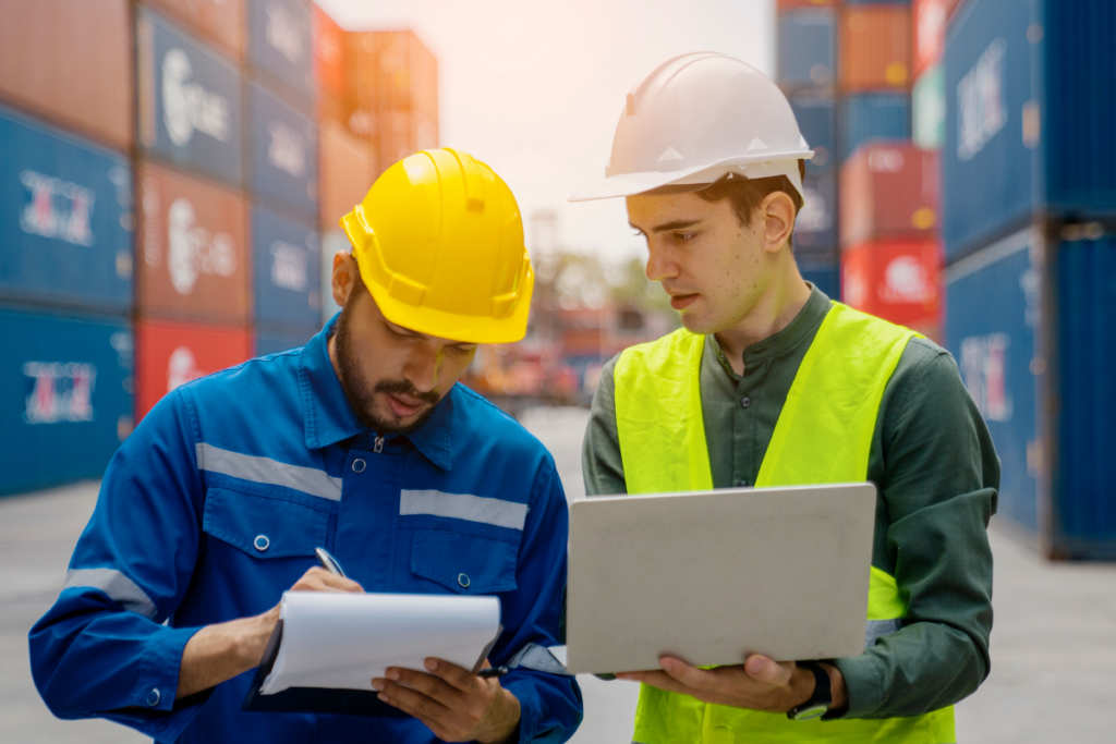 Two Workers Discussing A Supply Chain - Arrow Off Road - CNC Manufacturing Company