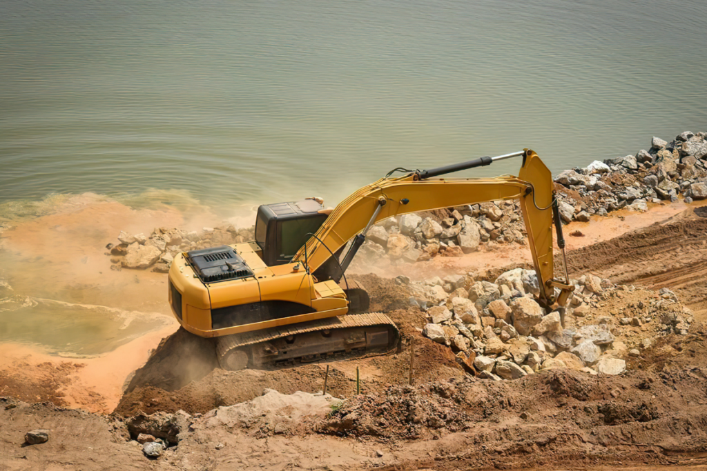 A Construction Crane Working In Dirt And Contaminants - Arrow Off Road - CNC Manufacturers In Canada